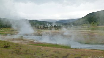 driving by Midwest Geyser Basin, Firehole River in foreground, Yellowstone