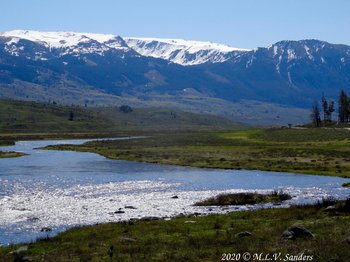 Mountain above a wide bend of the Green River in Wyoming