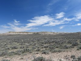 Interesting rock formations on a distant ridge.