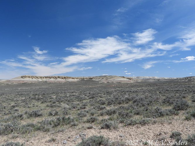 Interesting rock formations on a distant ridge.