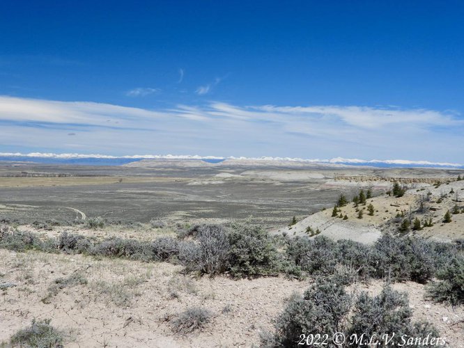 We are at the top of the ridge looking back at Ross Butte and Ross Ridge. The distant Wind River Range can be seen.