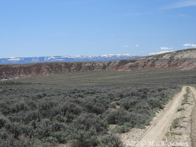 The hills changed from yellow to a red color. Near Big Piney