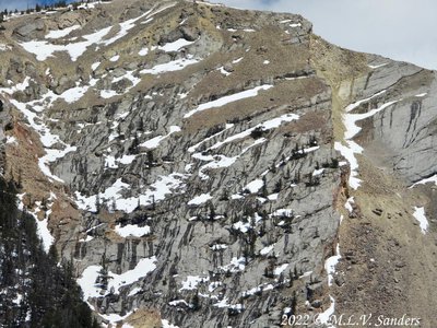 Dark streaks of melting snow and the snow creates a black and white pattern on the mountain side. Green River Lakes,